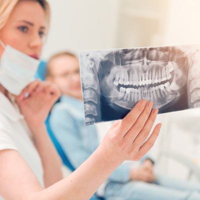 Dentist showing a patient his dental X-ray