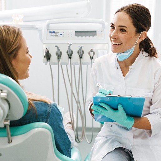 A woman consulting her dentist before a dental checkup