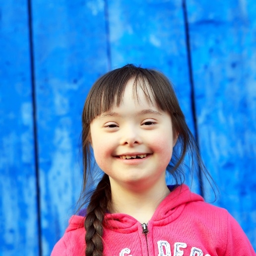 Little girl with special needs smiling