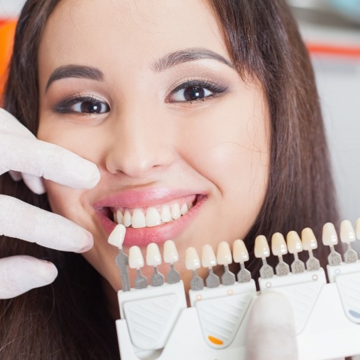 Young woman trying on dental veneers from her cosmetic dentist in Merrillville