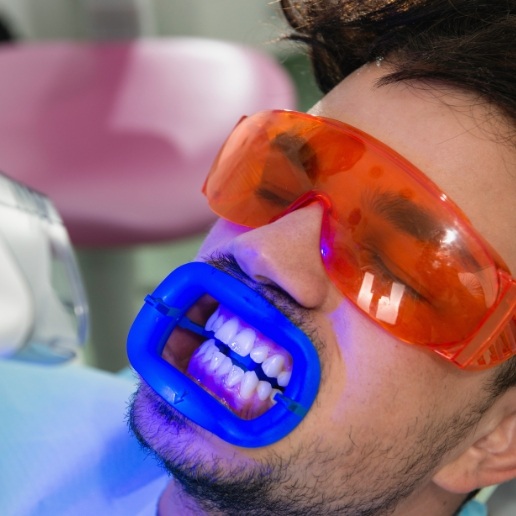 Man receiving teeth whitening from Merrillville cosmetic dentist