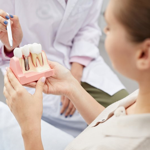 a patient in Merrillville learning about dental implants