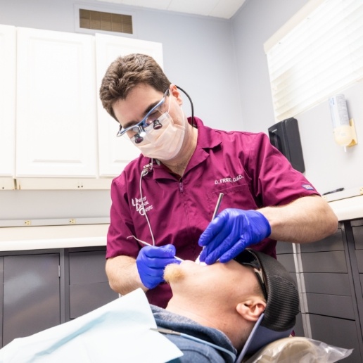 Doctor David Fried giving a patient a preventive dentistry exam in Merrillville